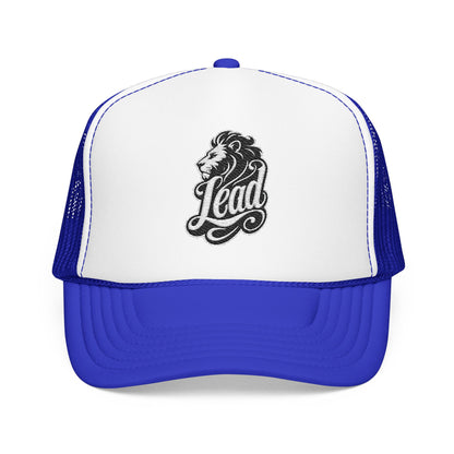 Blue and white trucker hat with a black lion head and the word "Lead".