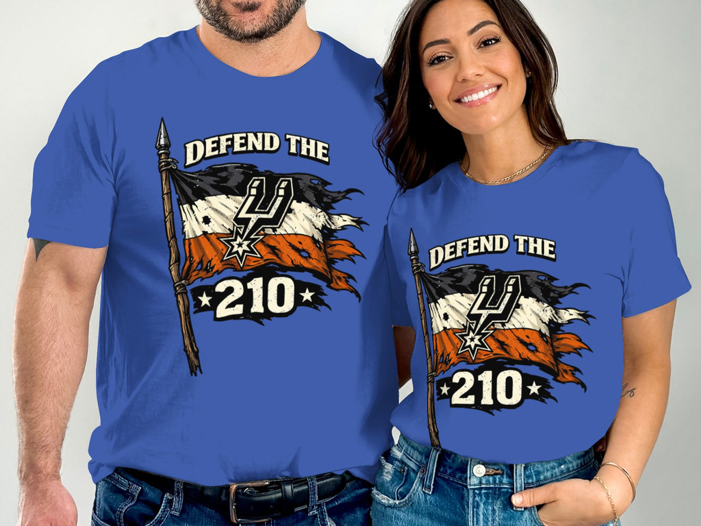 Two people wear blue t-shirts with "Defend the 210" and a tattered flag design.