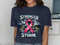 Navy t-shirt with graphic text "Stronger than the Storm" and pink ribbon.