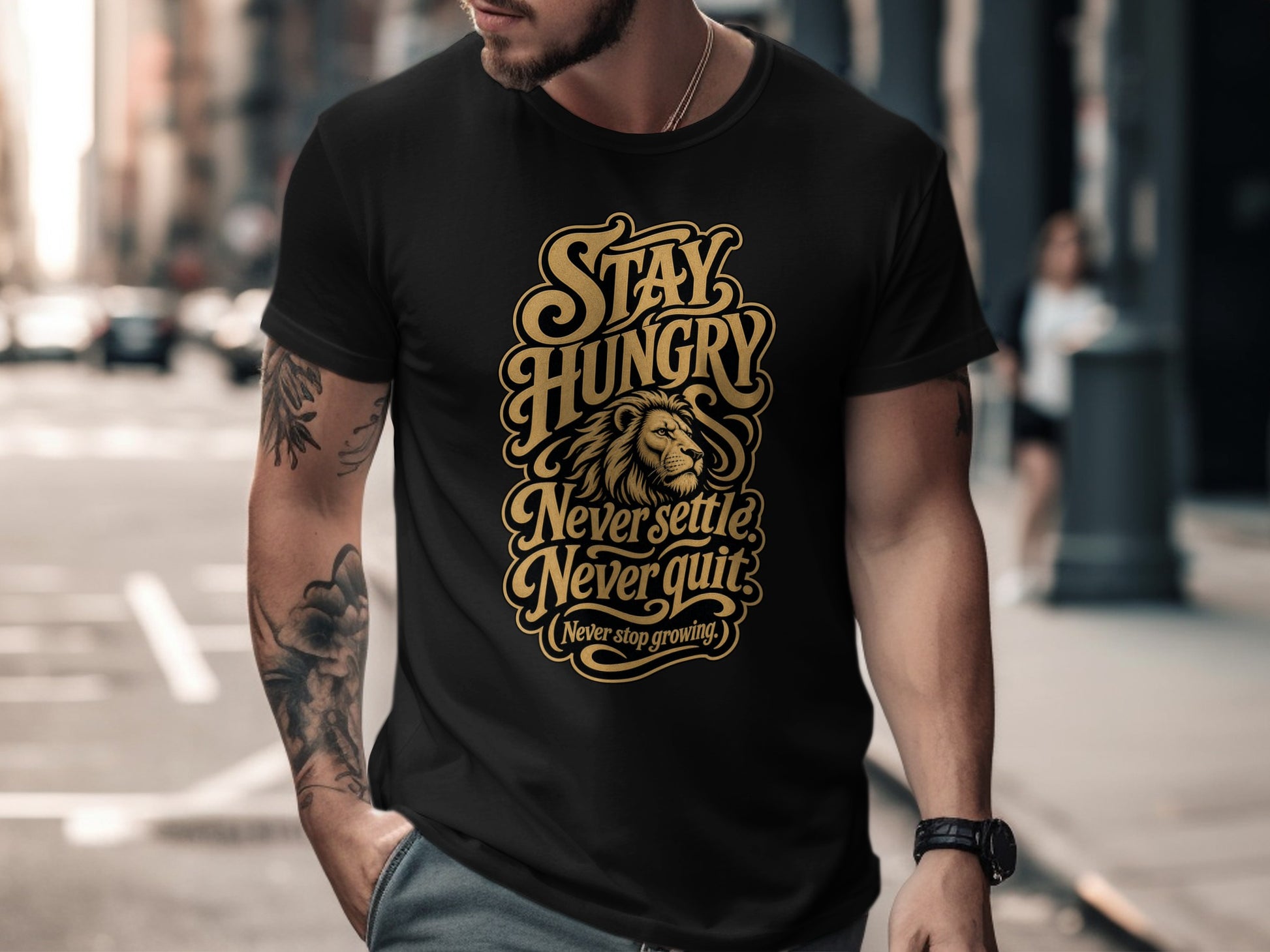 Black t-shirt with gold text "Stay Hungry Never Settle Never Quit".