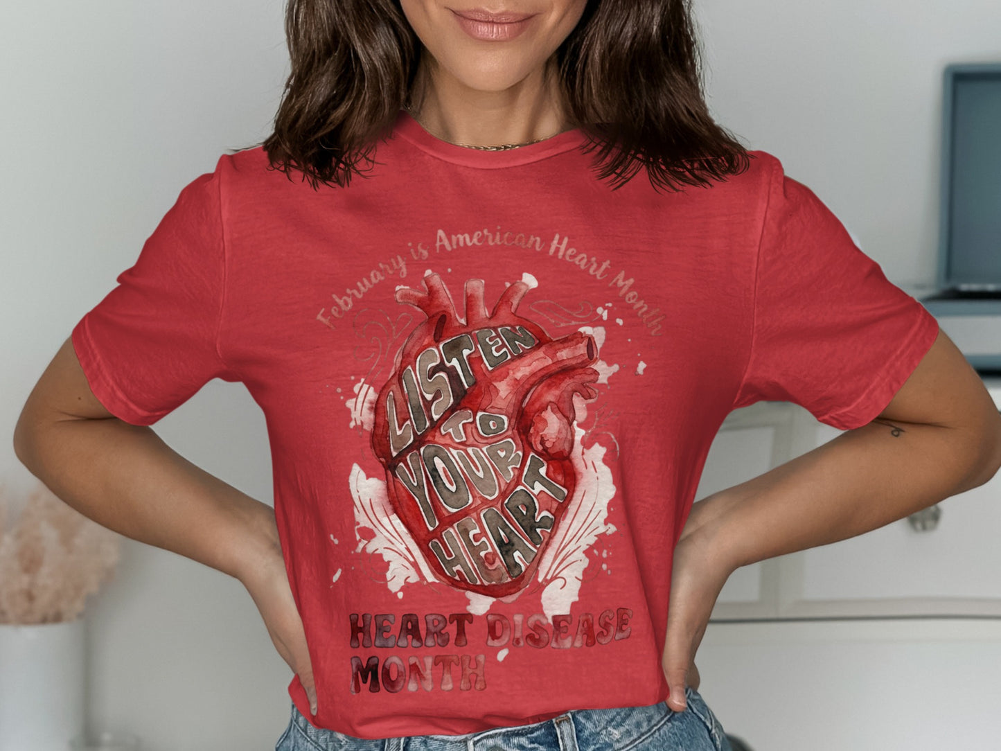 Red t-shirt with watercolor heart graphic and text "Listen to Your Heart".