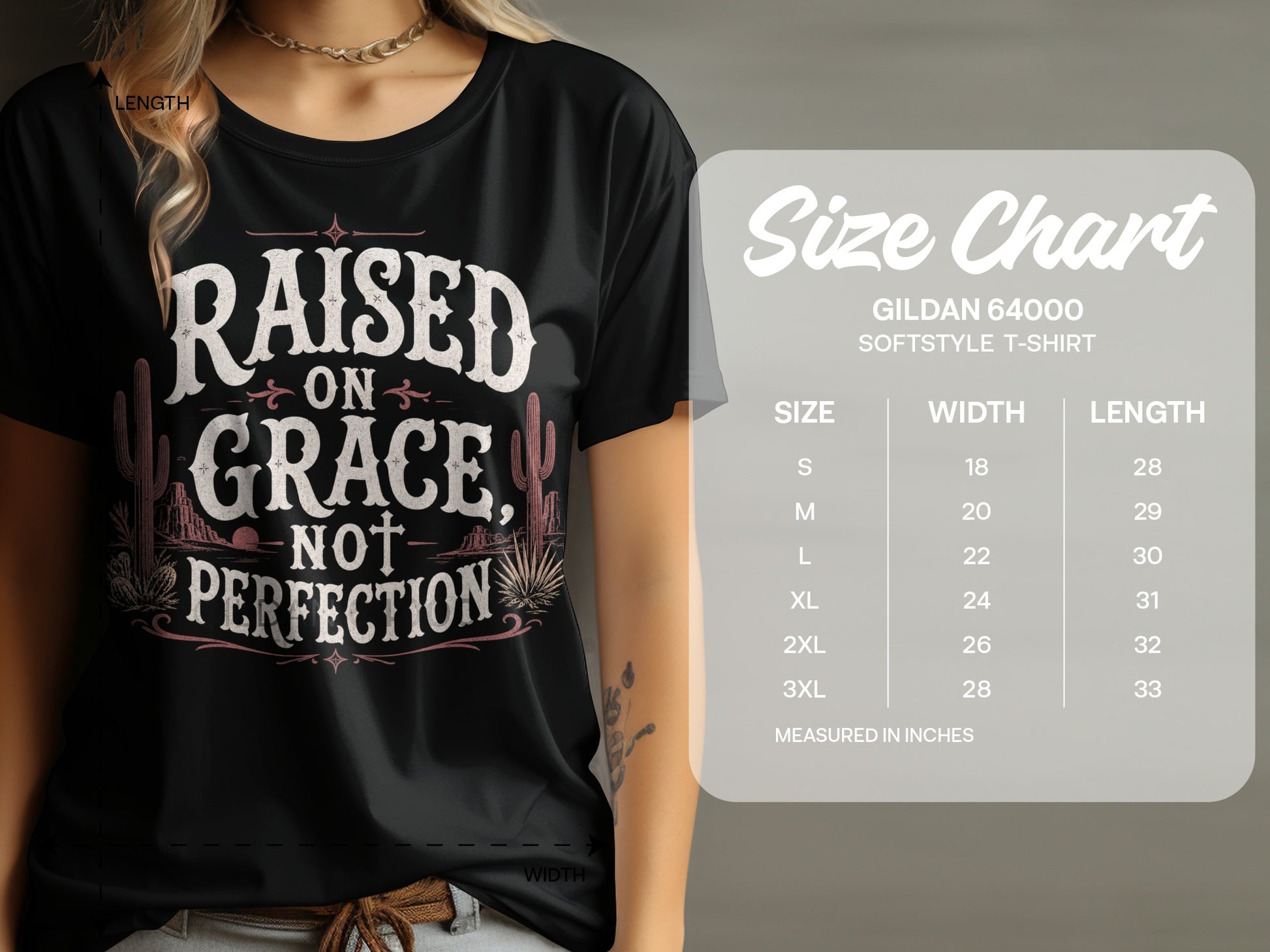 Black t-shirt with "Raised on Grace, Not Perfection" text and desert graphic, with size chart.