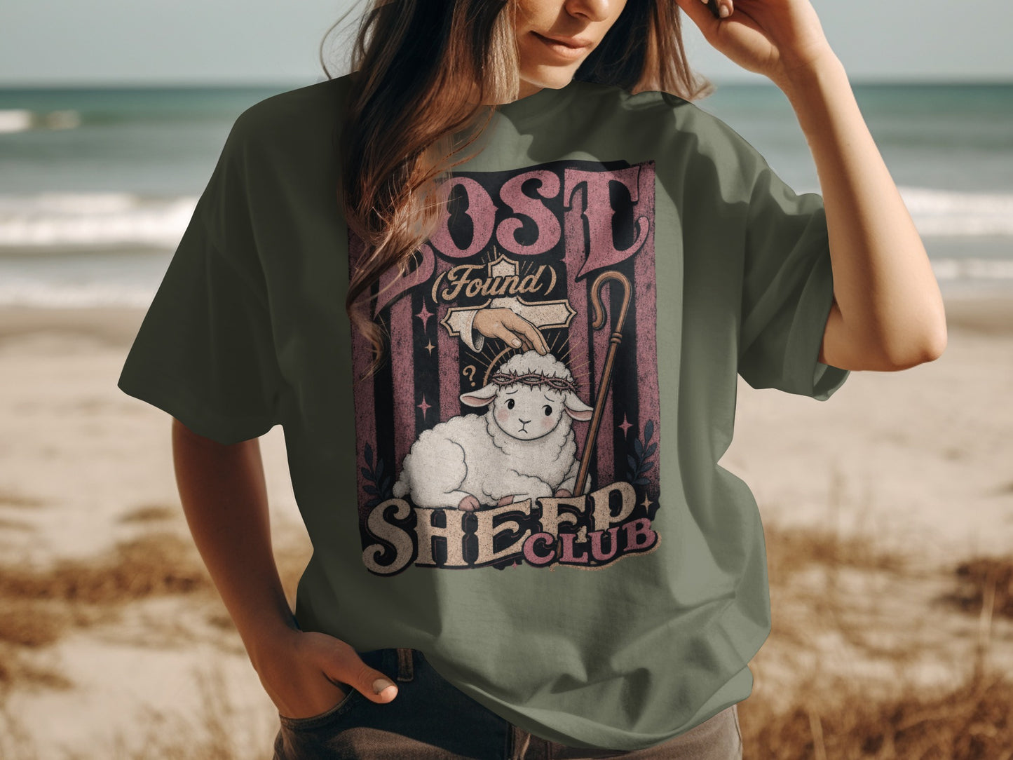 Olive green t-shirt featuring "Lost (Found)" sheep club graphic with sheep and shepherd's crook.