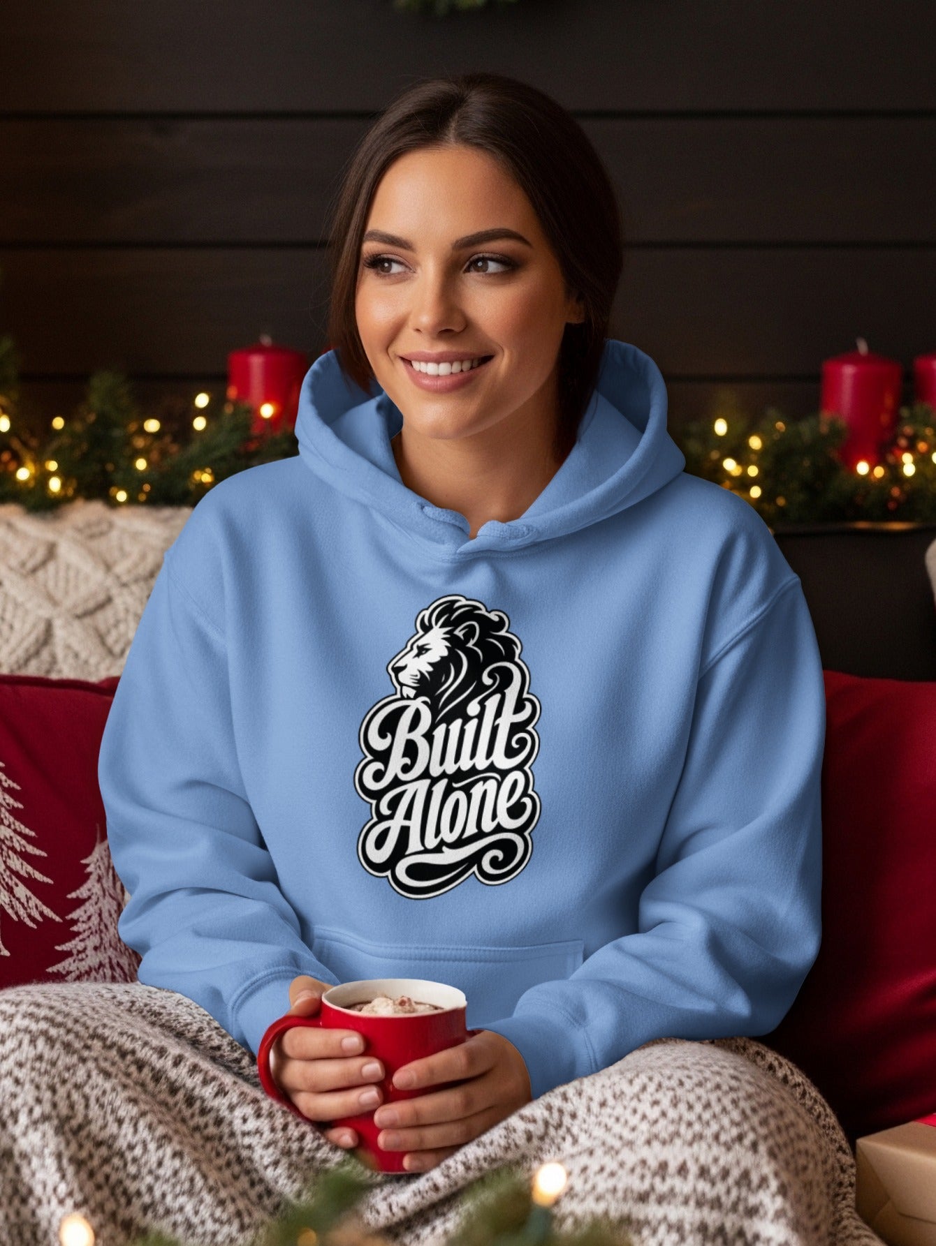 Light blue hoodie with a lion graphic and "Built Alone" text.