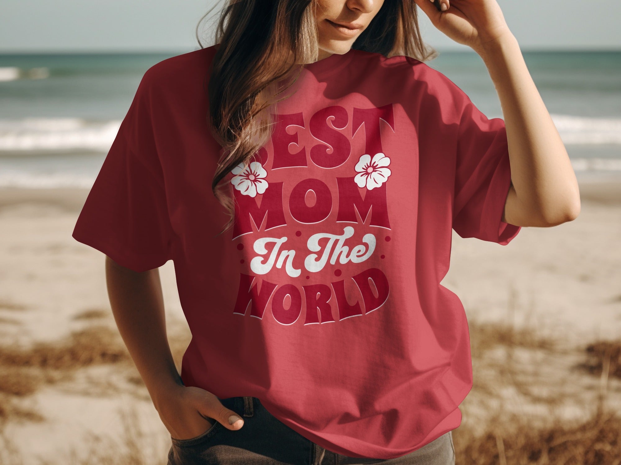 Red t-shirt with "Best Mom In The World" text and two white flowers.