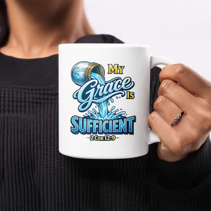 White mug with "My Grace is Sufficient" and "2 Cor 12:9" text.
