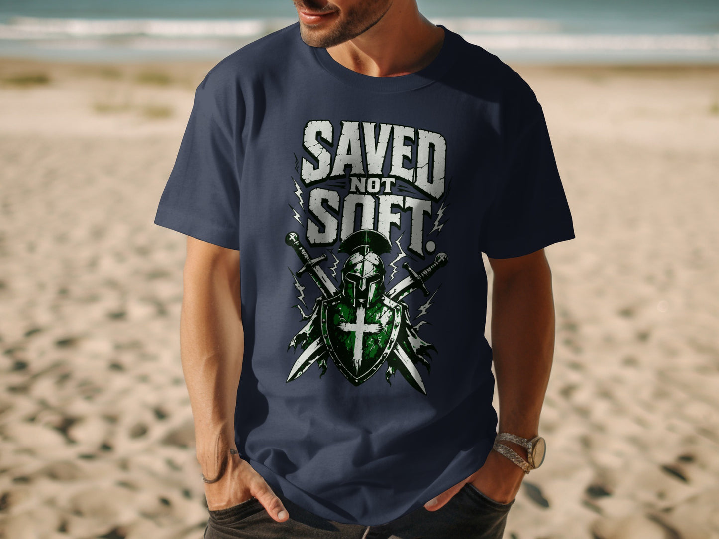 T-shirt with "SAVED NOT SOFT" text and knight's helmet and swords graphic.