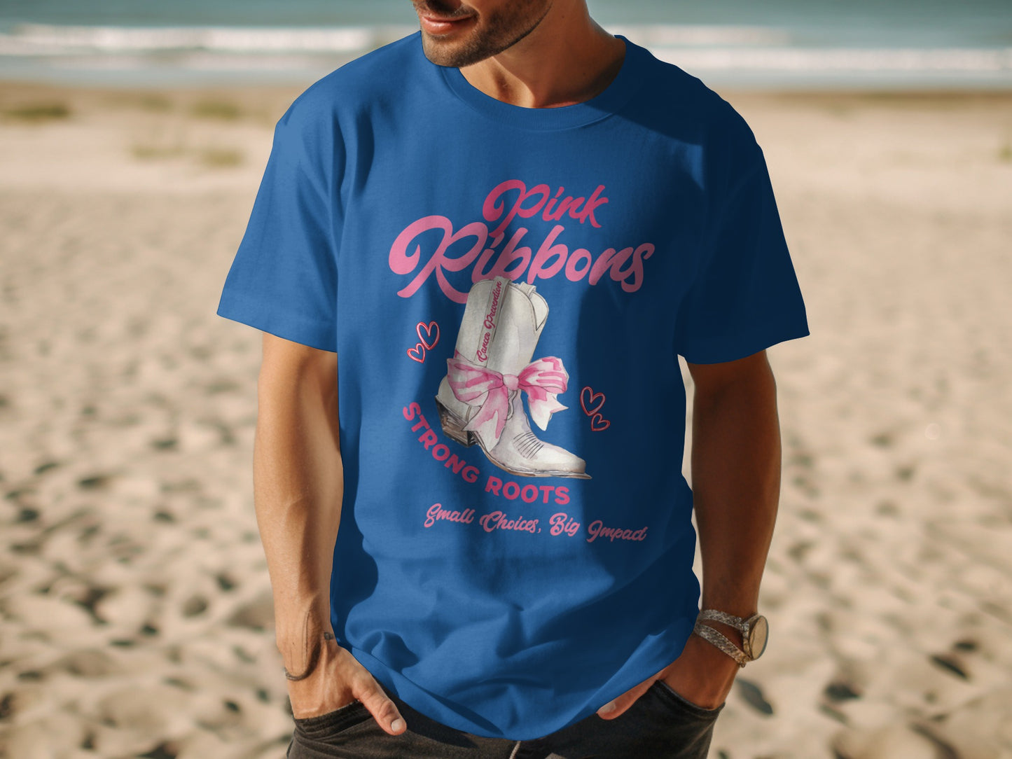 Blue t-shirt with "Pink Ribbons" and a white boot with a pink bow.