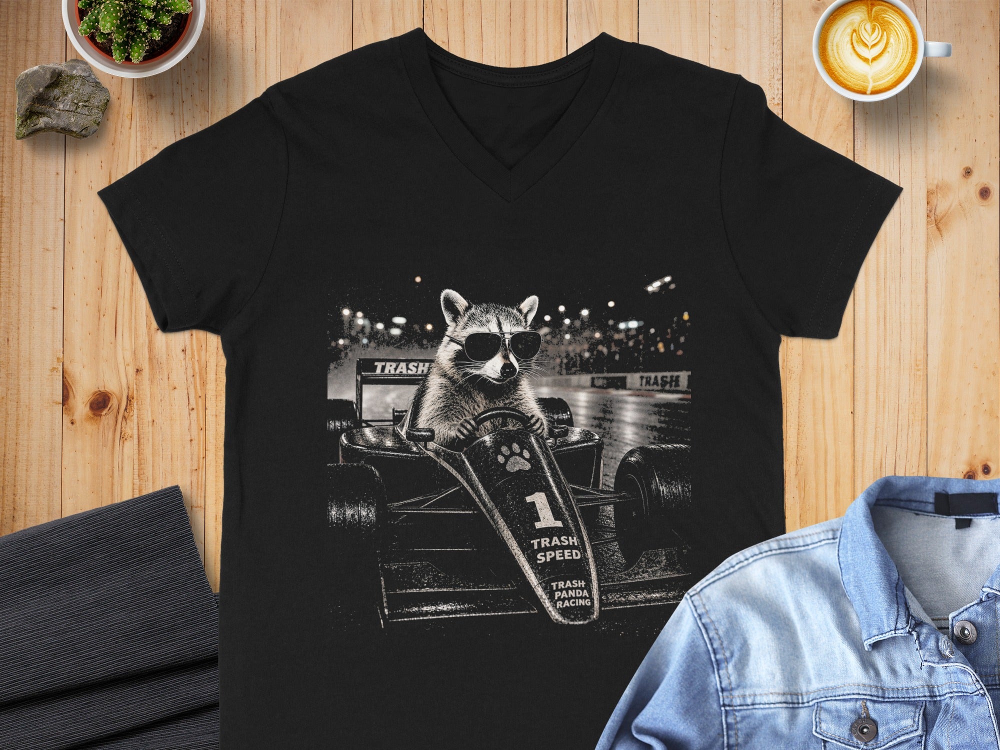 Black t-shirt with raccoon in race car graphic: Trash Speed, Trash Panda Racing.